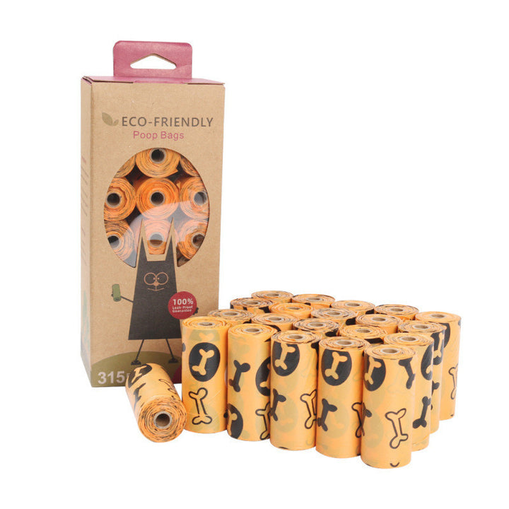 Eco-friendly dog poop bag set with 21 rolls of orange bags featuring black bone prints, shown with cardboard packaging displaying the rolls through a cut-out window