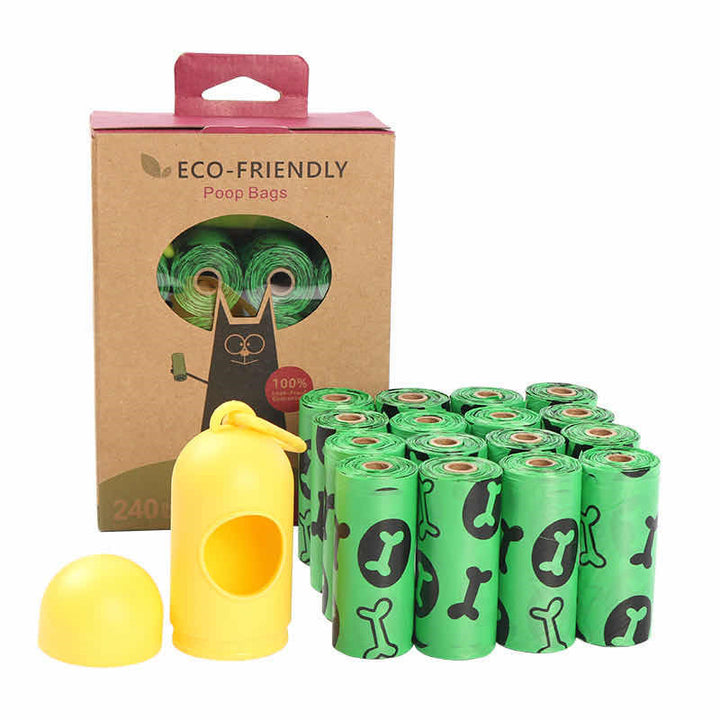 Eco-friendly dog poop bag set with 16 rolls of green bags featuring black bone prints, yellow clip-on dispenser, and cardboard packaging