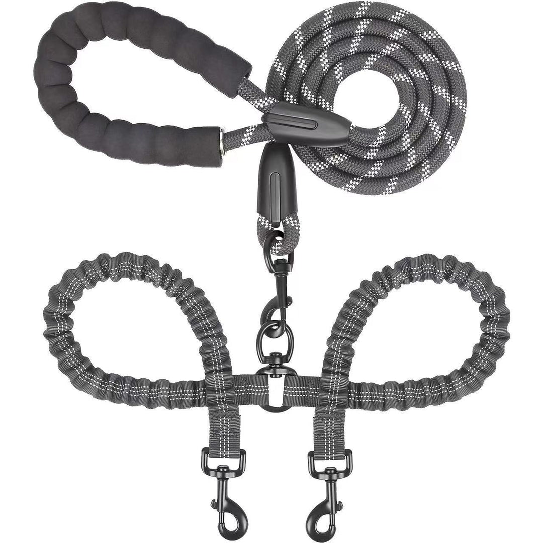 Dog leash with handle and two attachments on a white background