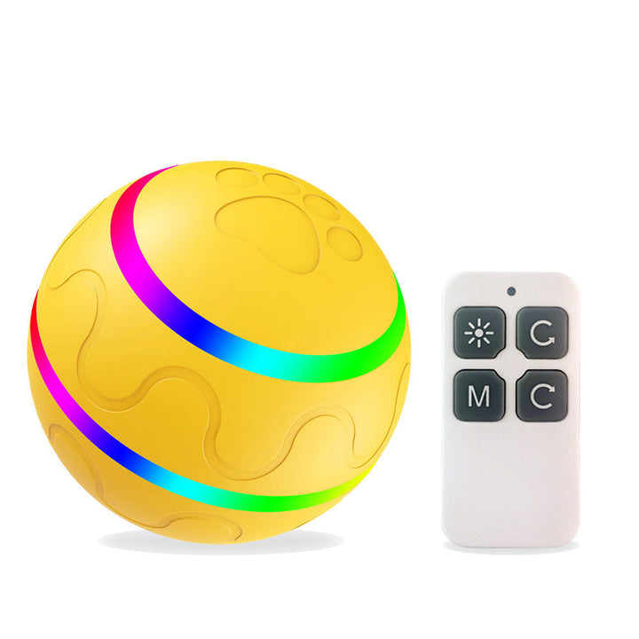 Yellow ball with colorful bands and a remote control on a white background