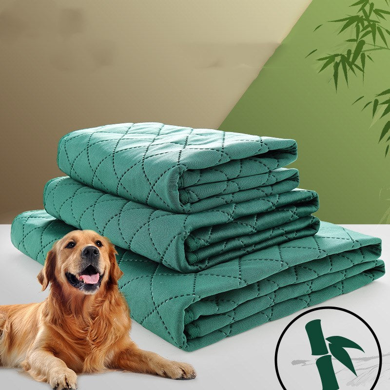 Stack of green quilted blankets with a dog lying next to them on a light background