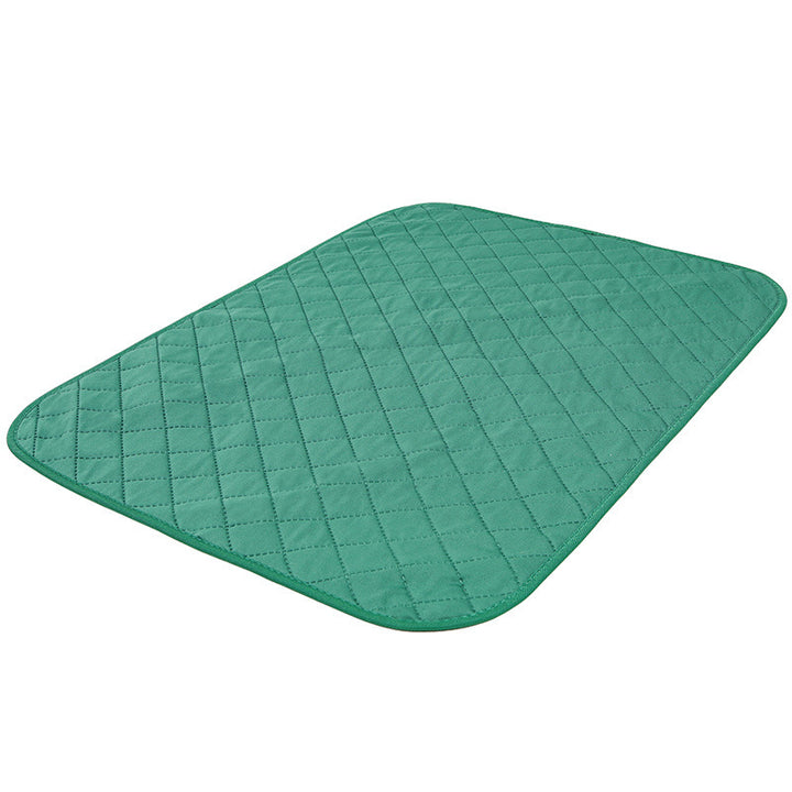 Green quilted mat on a white background