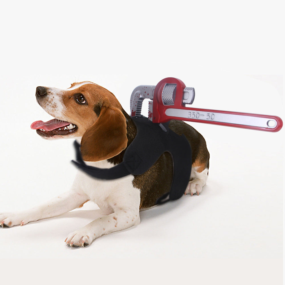 Dog wearing a harness with a red wrench tool on a white background
