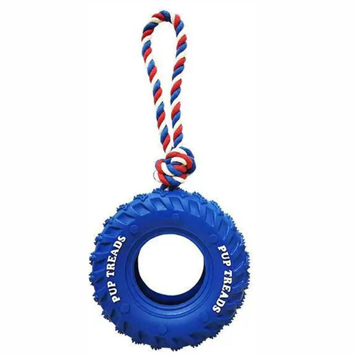Blue tire-shaped dog toy with a red, white, and blue rope on a white background
