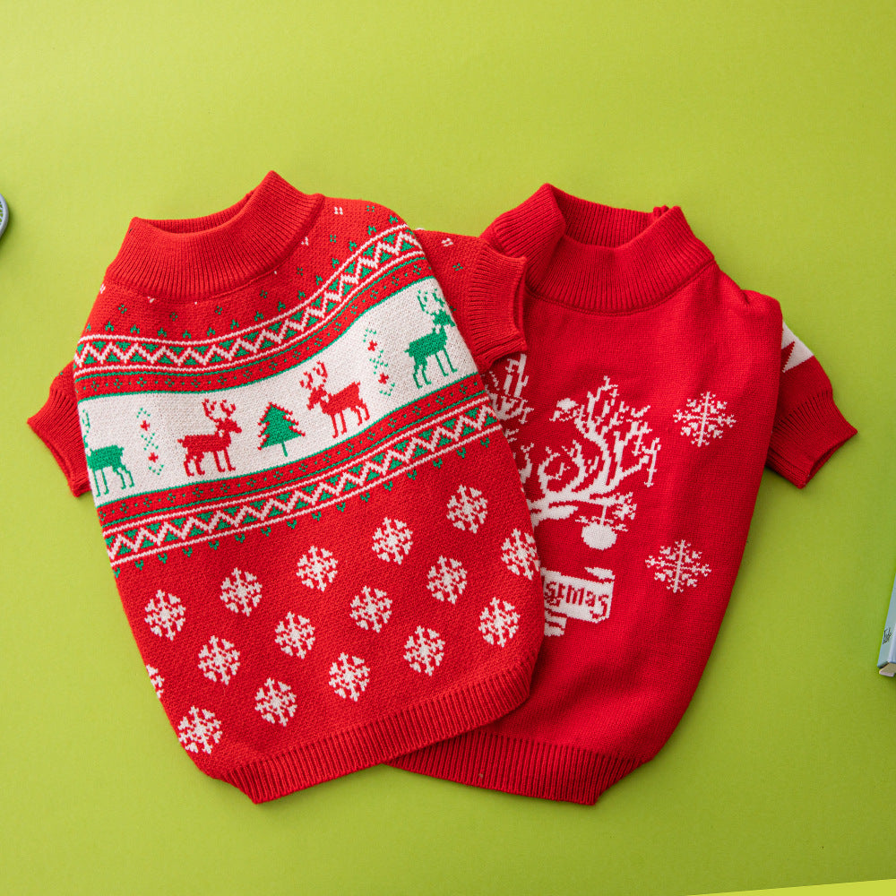 Two red dog sweaters with Christmas patterns on a green background