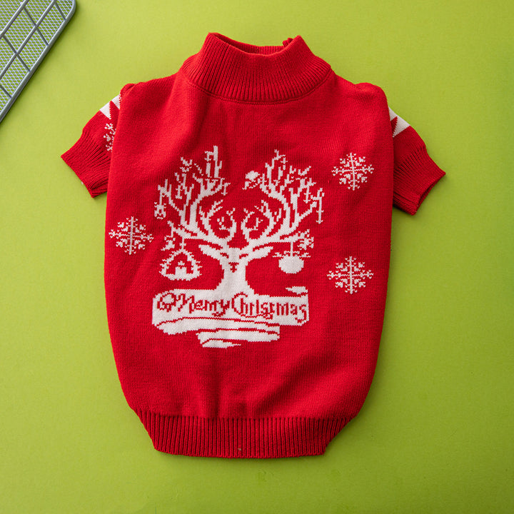 Red dog sweater with Christmas tree design on a green background