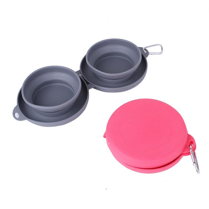 Collapsible dog bowls with pink carrying case on a white background