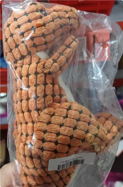 Dog toy made of knotted rope in clear packaging with a visible brand label.