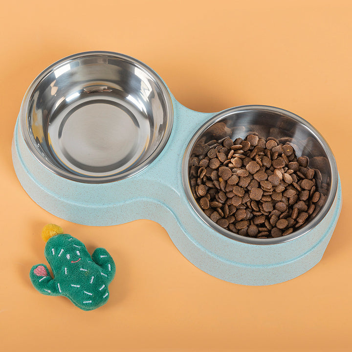 Pet food bowl with two compartments on a peach background