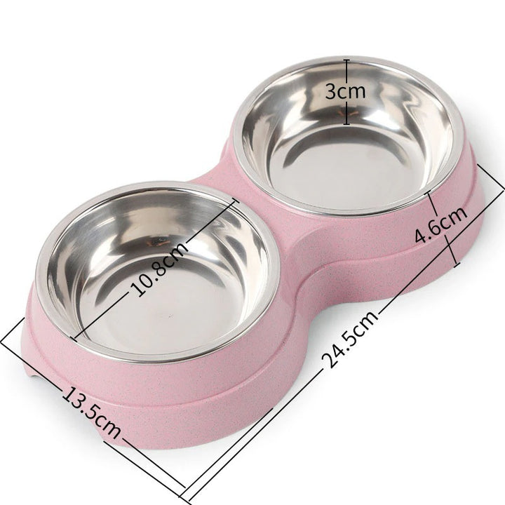 Pink pet bowl with stainless steel compartments and measurements on a white background