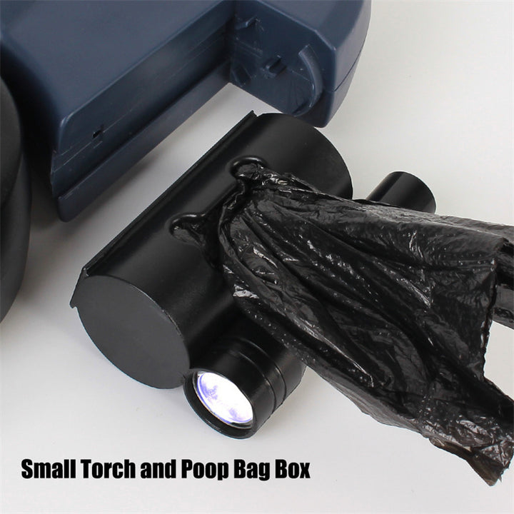 Small torch and poop bag box with a black plastic bag on a white background