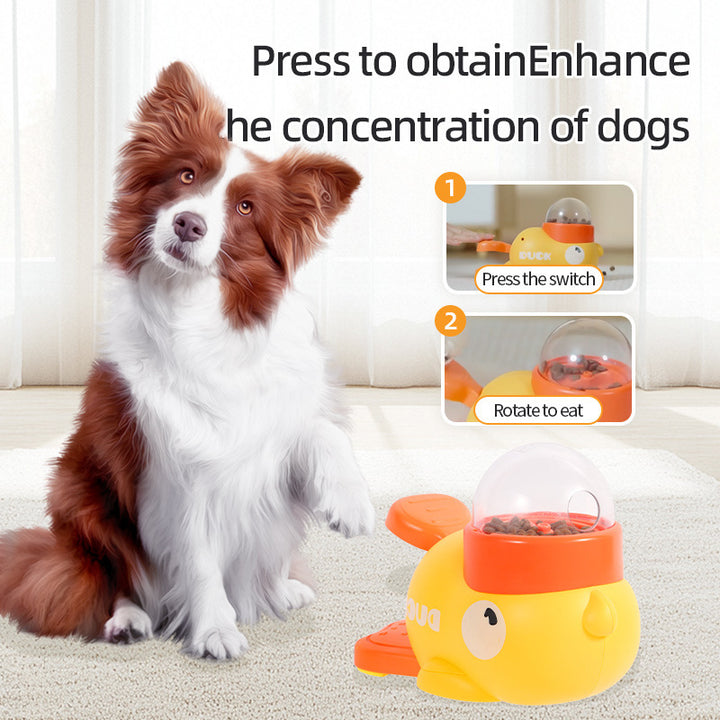 Dog sitting next to a yellow duck-shaped pet toy with text instructions on a light-colored carpet.