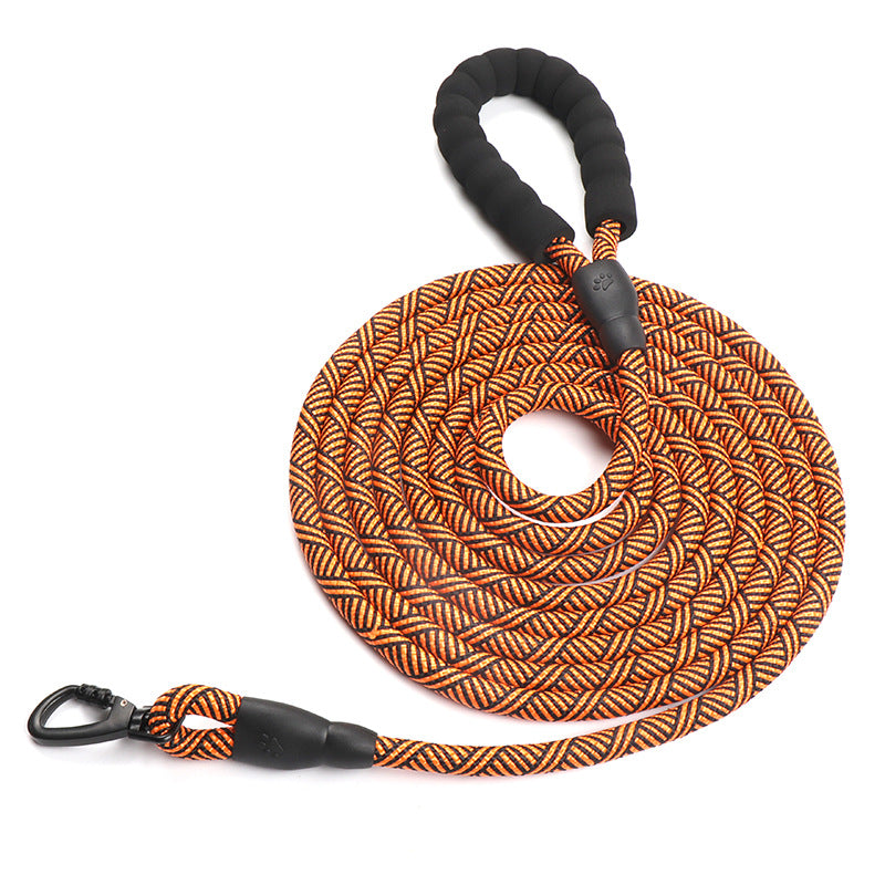 Orange and black braided dog leash with carabiners on a white background
