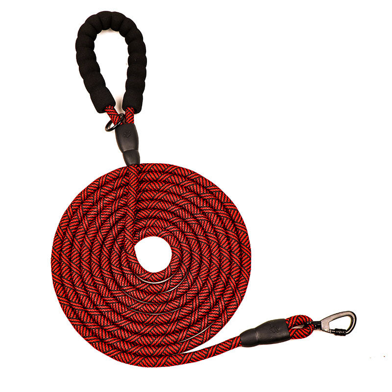 Red and black braided dog leash on a white background