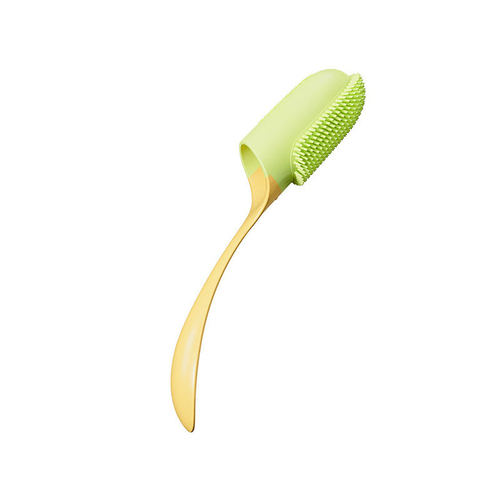 Green and gold dog tooth brush on a white background