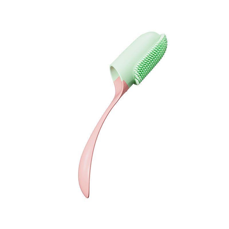 Green and pink pet tooth brush on a white background