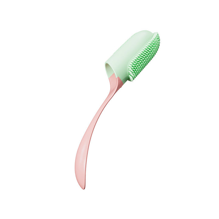 Green and pink pet tooth brush on a white background