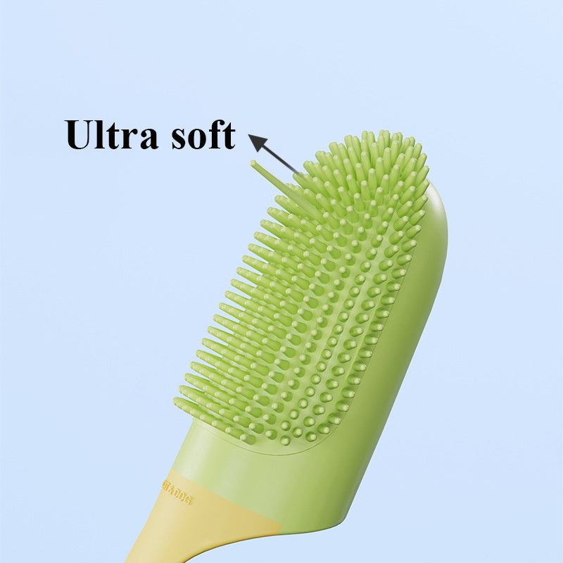 Green pet tooth brush with ultra soft bristles on a light blue background