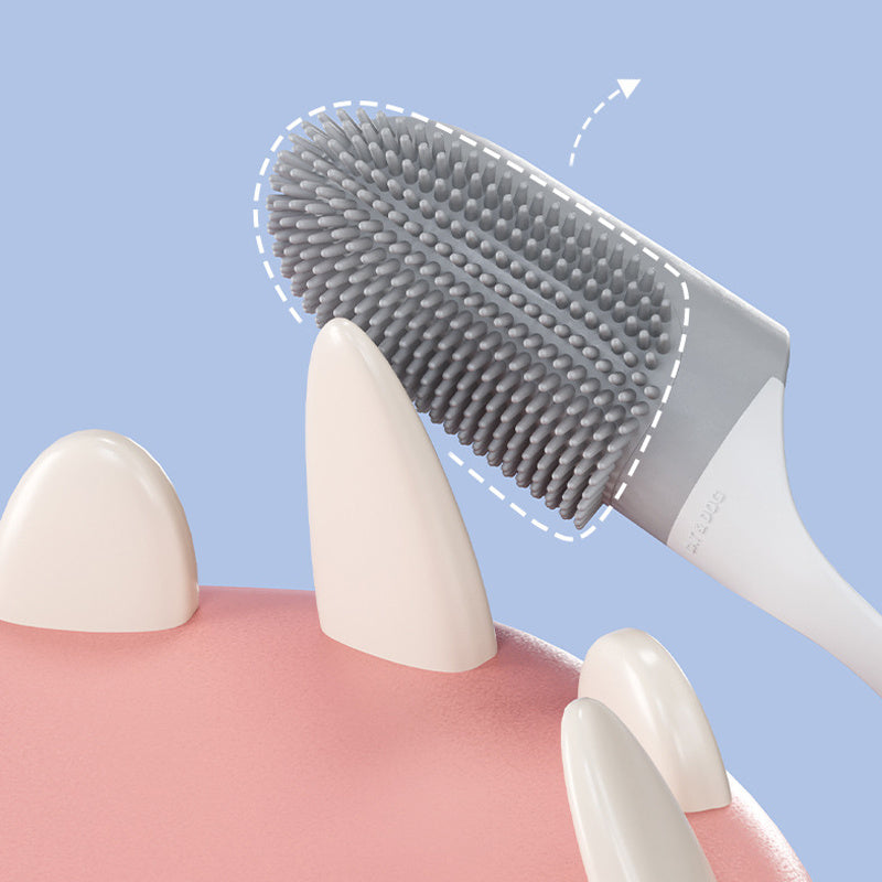 Dental cleaning brush with bristles touching a dental model on a blue background