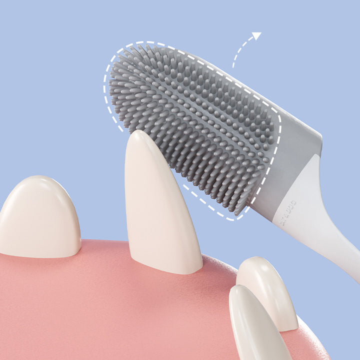 Dental cleaning brush with bristles touching a dental model on a blue background