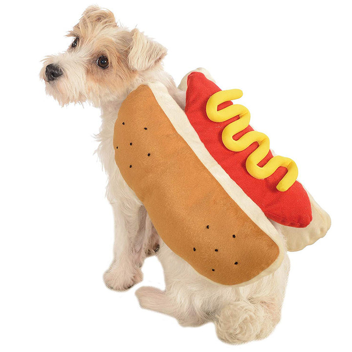 Dog wearing a hot dog costume with a bun, ketchup, and mustard on a white background
