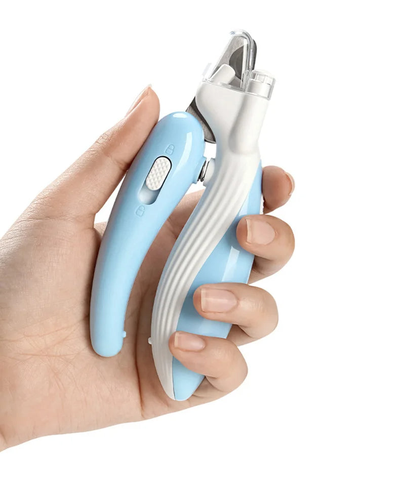 Hand holding a blue and white pet nail clipper against a white background