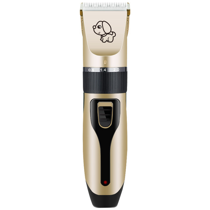 Gold and black pet grooming clipper on a white background