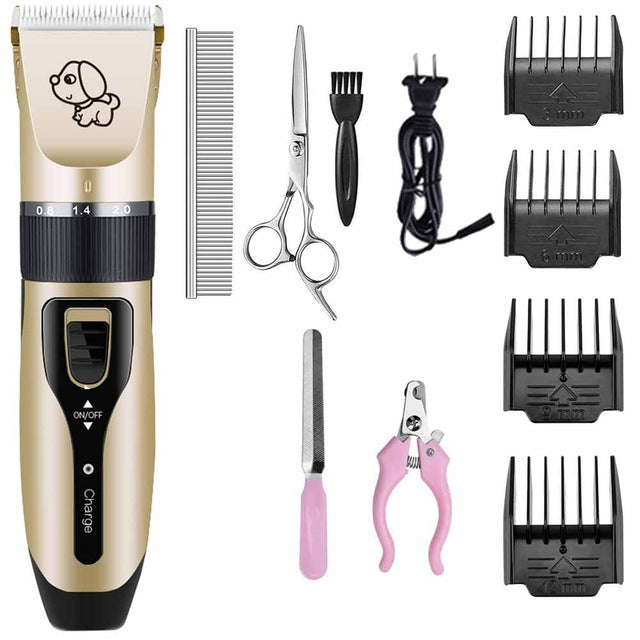 Pet grooming tool set with trimmer, comb, scissors, and nail clippers on a white background