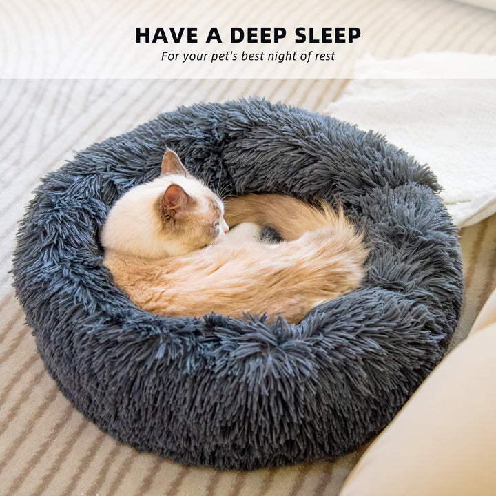 Cat sleeping in a fluffy gray pet bed with text 'Have a deep sleep' above it.