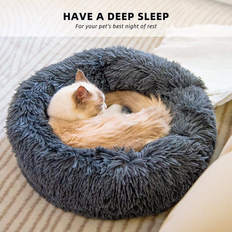 Cat sleeping in a fluffy gray pet bed with text 'Have a deep sleep' above it.