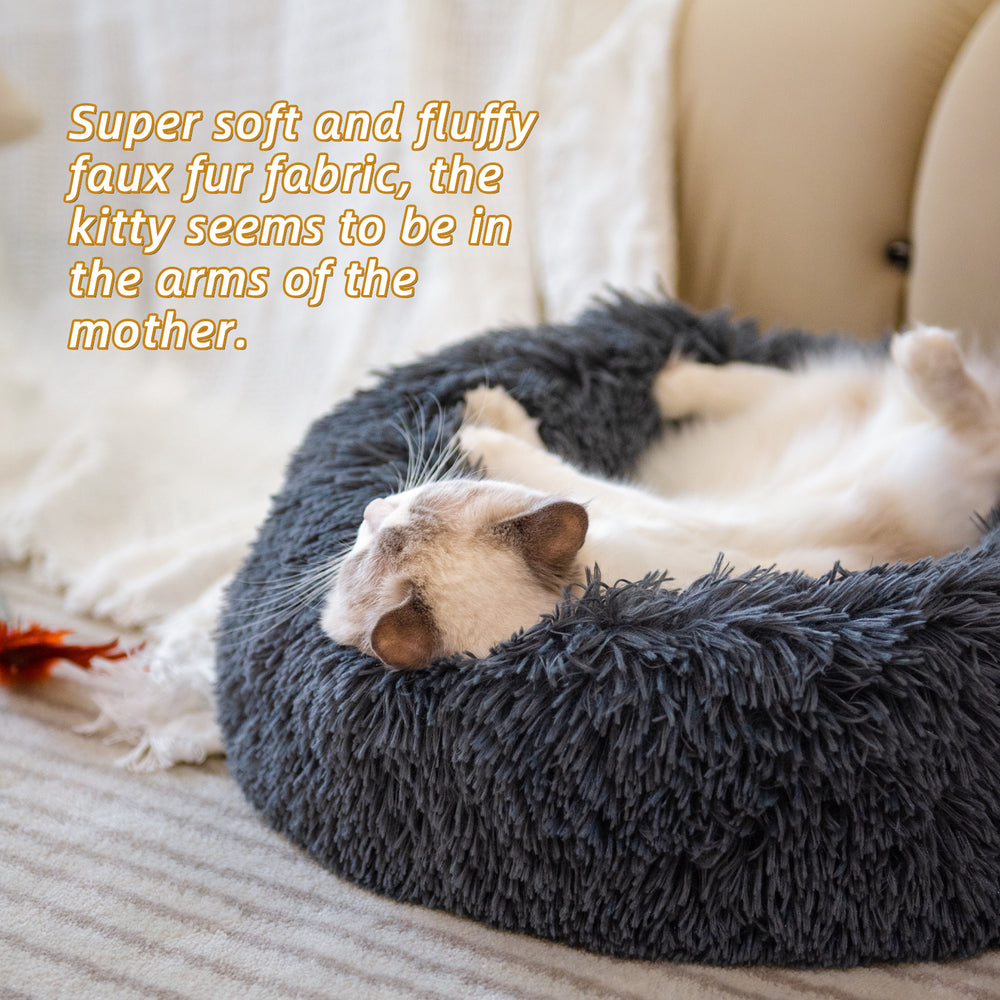 Cat lying on a fluffy gray pet bed with text describing the fabric texture.
