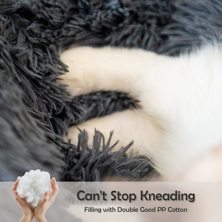 Text 'Can't Stop Kneading' with a hand holding a ball of white yarn against a textured background.