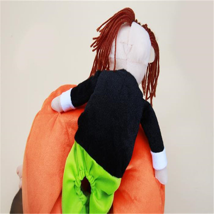 Plush toy with orange cape and green pants on a beige background