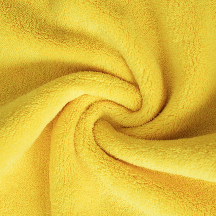 Close-up of yellow fabric with a soft texture