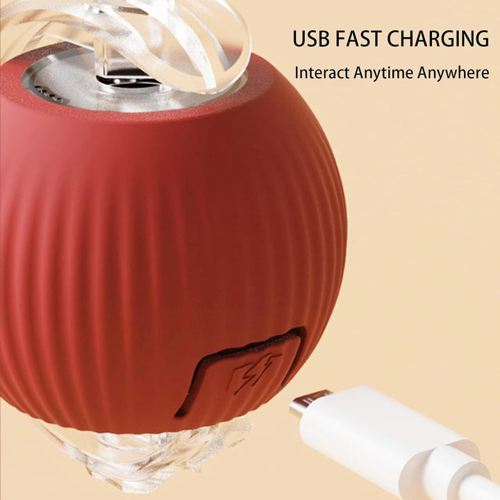 Red electronic device with USB cable on a beige background