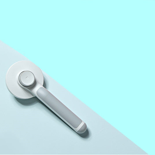 White kitchen tool on a light blue background