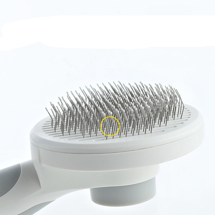 Pet grooming brush with a focus on the bristles on a white background