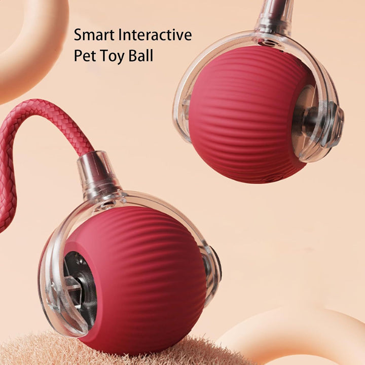 Smart interactive pet toy ball with a pink interior and clear exterior on a beige background.