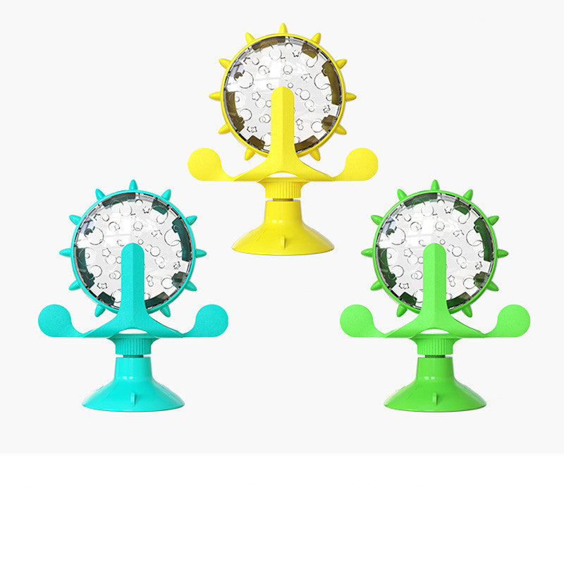 Three colorful suction cup toys with circular designs on a white background