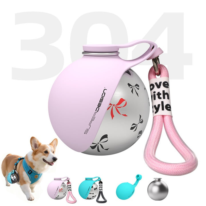 Pink dog toy with a keychain and a dog in the background