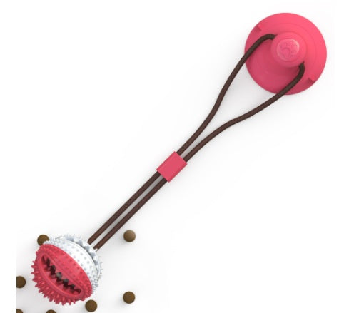 Pink and brown dog toy with a chewable part on a white background