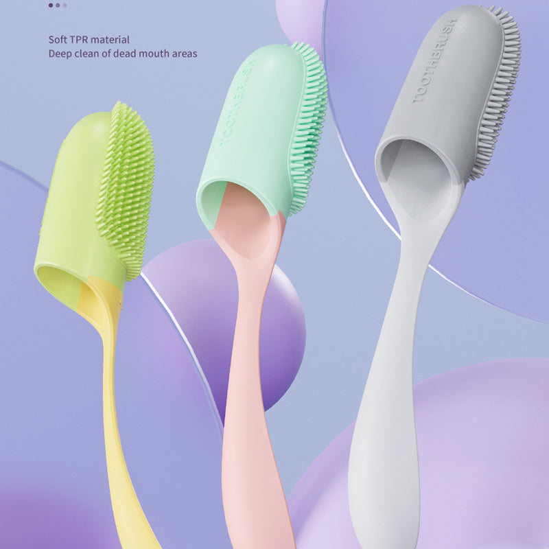 Three silicone pet tooth brushes in green, pink, and gray on a colorful abstract background.