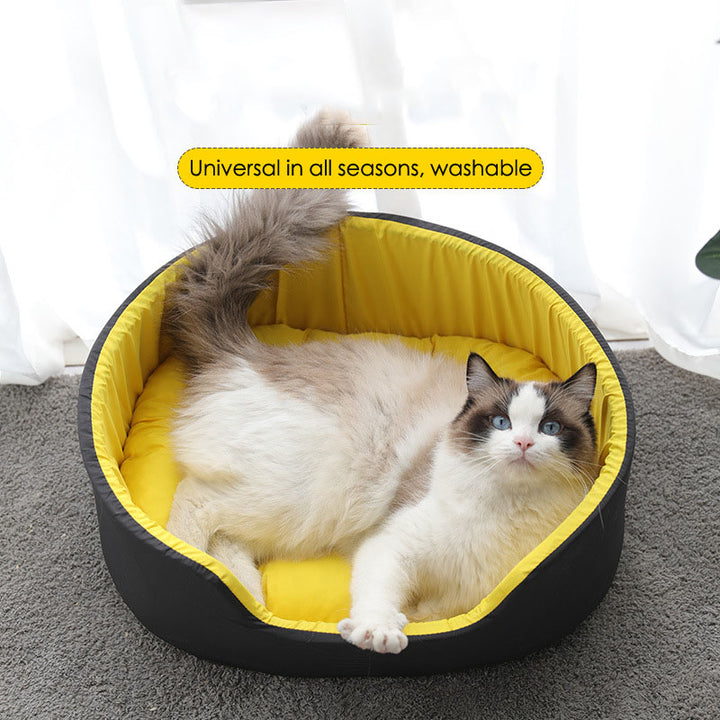 Cat lying on a yellow and black pet bed with text 'Universal in all seasons, washable'.