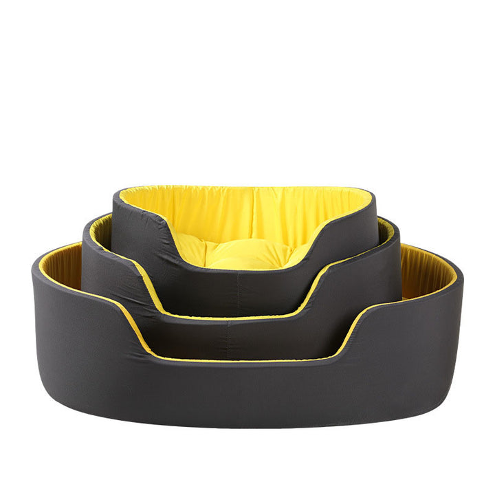 Set of three pet beds in black with yellow interior on a white background