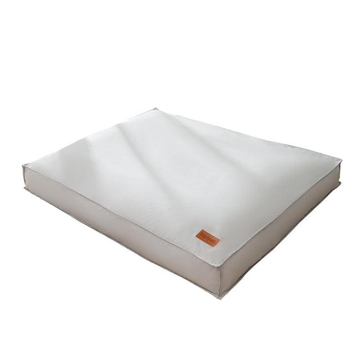 White pet bed with a brown label on a white background