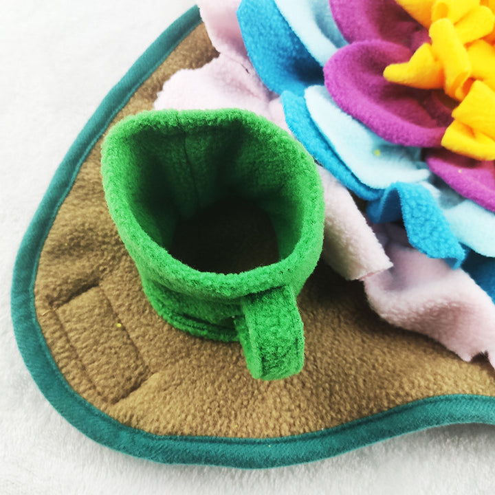 A colorful snuffle mat for dogs designed with multiple pockets and fabric folds to store treats.
