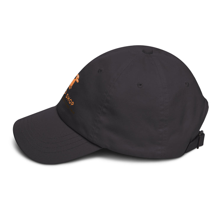 Black cap with doggo shop logo on the side against a white background