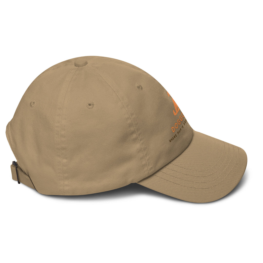 Beige baseball cap with doggo shop logo on a white background