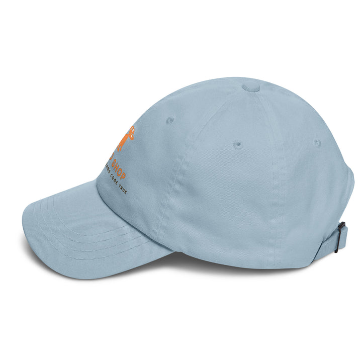 Light blue cap with doggo shop logo print on a white background