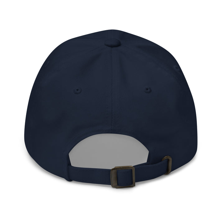 Navy blue cap with a gray patch and brown buckle on a white background